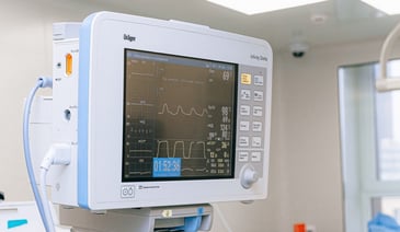 Patient monitoring system screen in hospital room